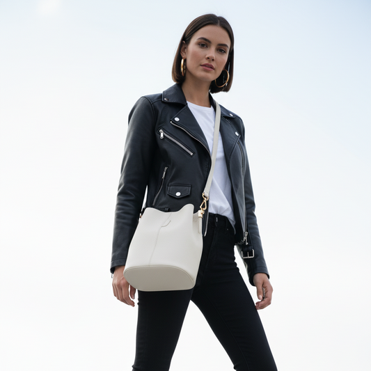 Low angle upward shot with cream bucket bag