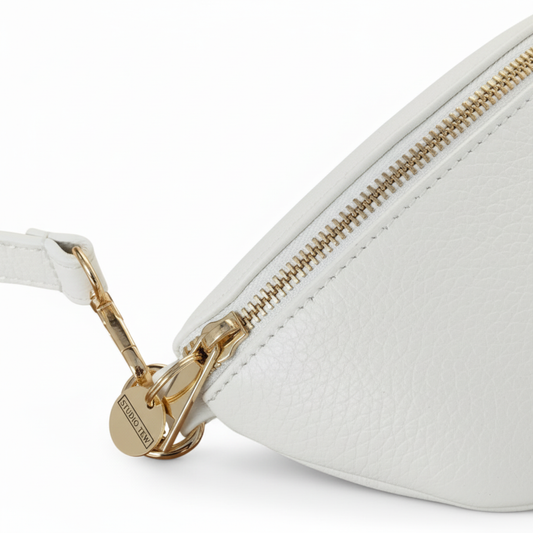 White belt bag zipper detail with STUDIO TEW tag